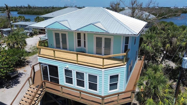8152 Little Gasparilla Is, Placida, FL 33946 - back of property with metal roof, a water view, french doors, and a balcony