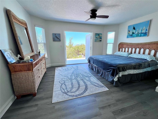 8152 Little Gasparilla Is, Placida, FL 33946 - bedroom featuring baseboards, wood finished floors, access to outside, and a textured ceiling