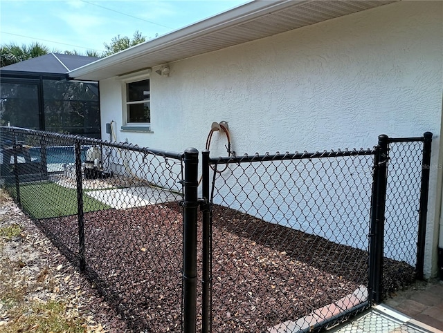 view of property exterior featuring fence and stucco siding