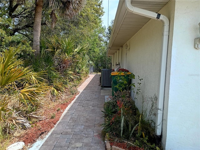 view of property exterior featuring stucco siding and cooling unit