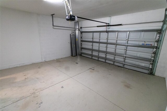 15968 Honeysuckle St, Port Charlotte, FL 33953 - garage featuring a garage door opener
