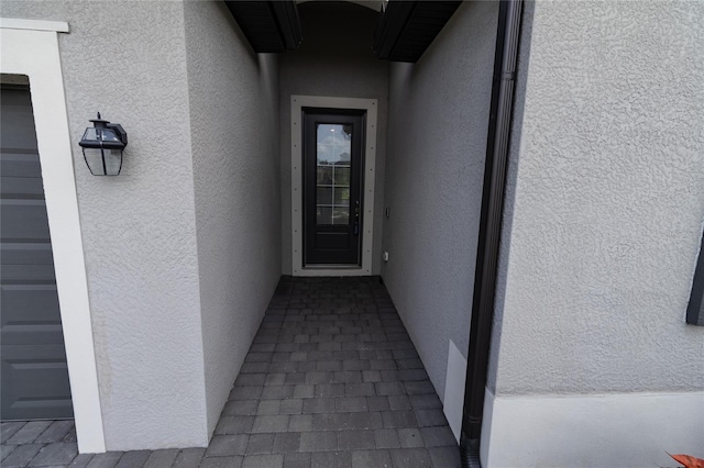 15968 Honeysuckle St, Port Charlotte, FL 33953 - view of exterior entry featuring stucco siding