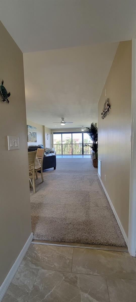 1551 Beach Rd Unit 412, Englewood, FL 34223 - hallway featuring baseboards