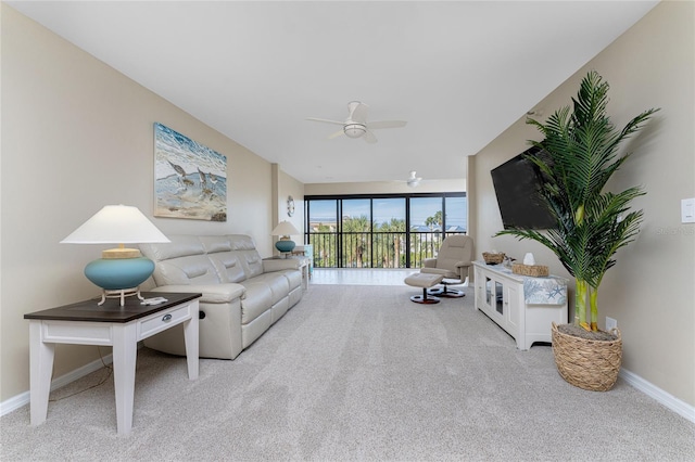 1551 Beach Rd Unit 412, Englewood, FL 34223 - living area featuring carpet flooring, a ceiling fan, and baseboards