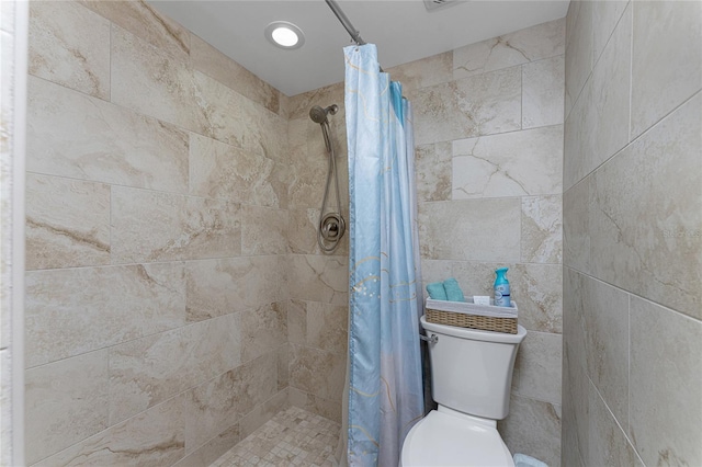 1551 Beach Rd Unit 412, Englewood, FL 34223 - bathroom featuring a tile shower and toilet