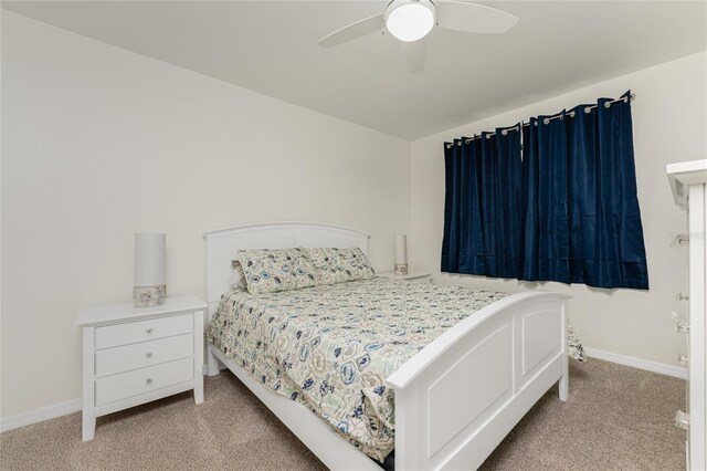 1551 Beach Rd Unit 412, Englewood, FL 34223 - bedroom featuring light carpet, baseboards, and ceiling fan