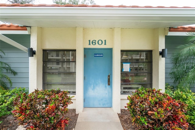 1551 Beach Rd Unit 412, Englewood, FL 34223 - view of exterior entry featuring stucco siding