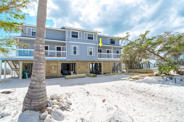 301 S Gulf Blvd Unit 419, Placida, FL 33946 - back of house featuring stairs