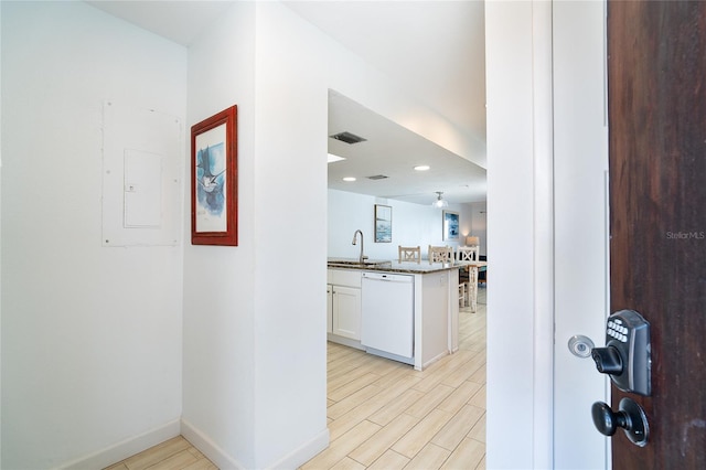 301 S Gulf Blvd Unit 419, Placida, FL 33946 - hall with baseboards, visible vents, electric panel, and light wood-type flooring
