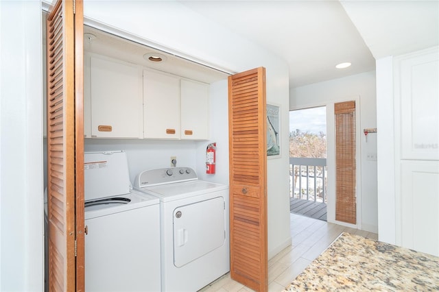 301 S Gulf Blvd Unit 419, Placida, FL 33946 - clothes washing area featuring cabinet space, washer and clothes dryer, and recessed lighting