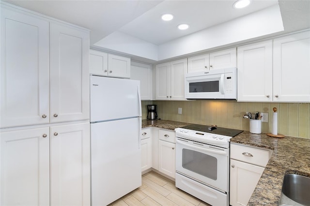 301 S Gulf Blvd Unit 419, Placida, FL 33946 - kitchen featuring white appliances, recessed lighting, white cabinets, and dark stone countertops