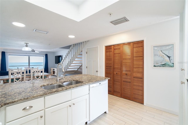 301 S Gulf Blvd Unit 419, Placida, FL 33946 - kitchen with a sink, stone counters, visible vents, white cabinets, and white dishwasher