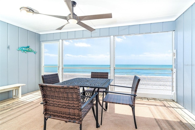 301 S Gulf Blvd Unit 419, Placida, FL 33946 - sunroom with outdoor dining area, a water view, and ceiling fan