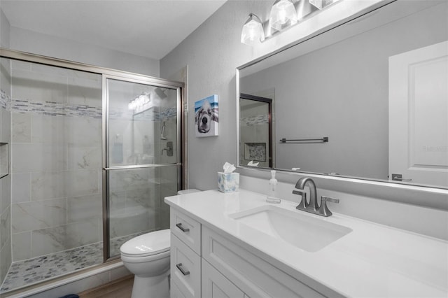 316 Coldeway Dr Unit 29, Punta Gorda, FL 33950 - full bathroom featuring toilet, vanity, a textured wall, and a shower stall
