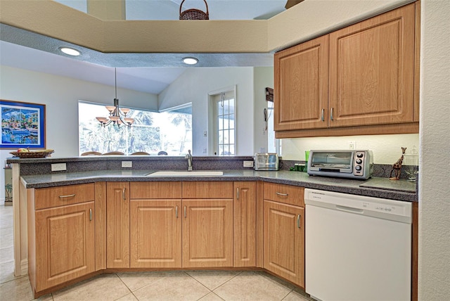 1078 Boundary Blvd, Rotonda West, FL 33947 - kitchen with dishwasher, a sink, a chandelier, light tile patterned flooring, and a peninsula