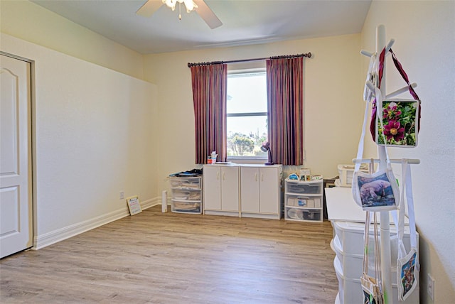 1078 Boundary Blvd, Rotonda West, FL 33947 - misc room with light wood-style floors, a ceiling fan, and baseboards