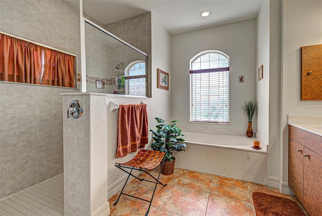 1078 Boundary Blvd, Rotonda West, FL 33947 - full bathroom featuring a walk in shower, vanity, and a garden tub