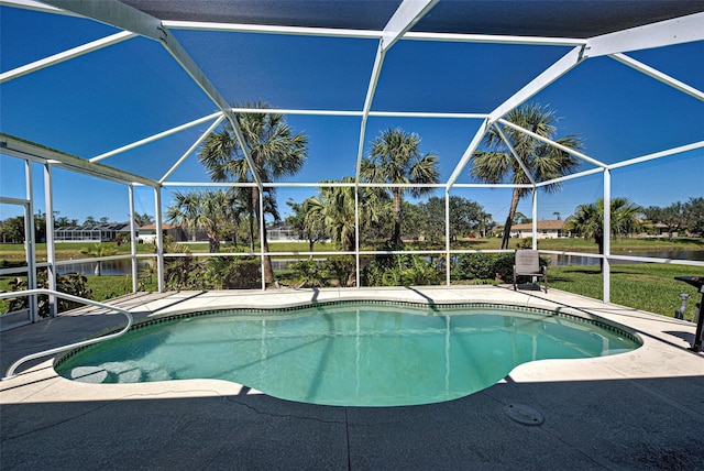 1078 Boundary Blvd, Rotonda West, FL 33947 - outdoor pool featuring a lanai, a water view, and a patio area
