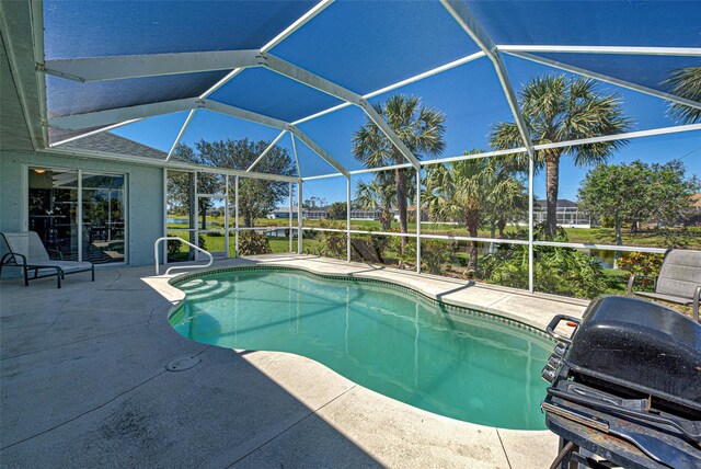 1078 Boundary Blvd, Rotonda West, FL 33947 - outdoor pool featuring a patio, a lanai, and a grill