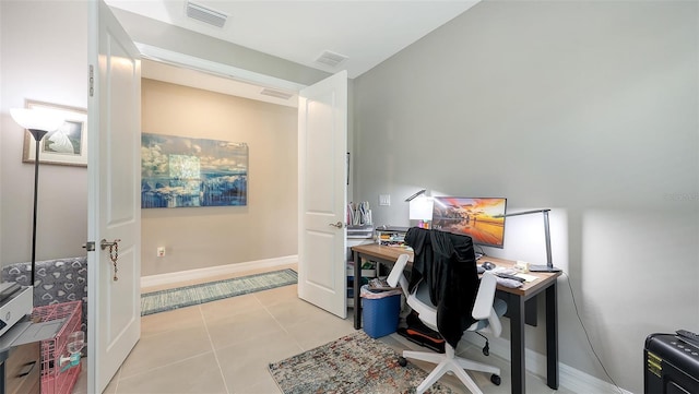 2117 Laurifolia Ct, North Port, FL 34289 - home office featuring baseboards, visible vents, and light tile patterned floors