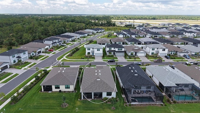2117 Laurifolia Ct, North Port, FL 34289 - drone / aerial view featuring a residential view