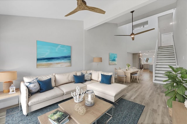 6030 Boca Grande Cswy Unit B21, Boca Grande, FL 33921 - living area with stairway, a ceiling fan, and wood finished floors