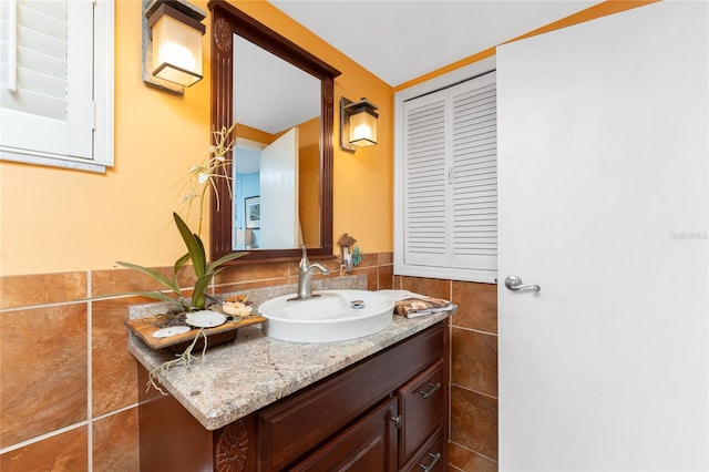 1670 Faust Dr, Englewood, FL 34224 - bathroom featuring vanity and tile walls