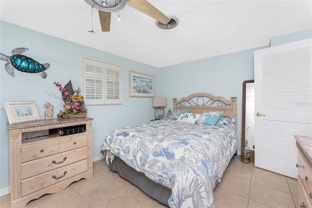 1670 Faust Dr, Englewood, FL 34224 - bedroom featuring light tile patterned flooring, baseboards, a ceiling fan, and visible vents