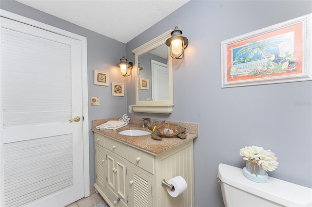 1670 Faust Dr, Englewood, FL 34224 - half bath with toilet, vanity, and tile patterned flooring