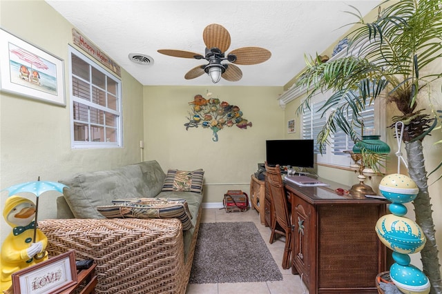 1670 Faust Dr, Englewood, FL 34224 - living area featuring baseboards, light tile patterned flooring, ceiling fan, and visible vents