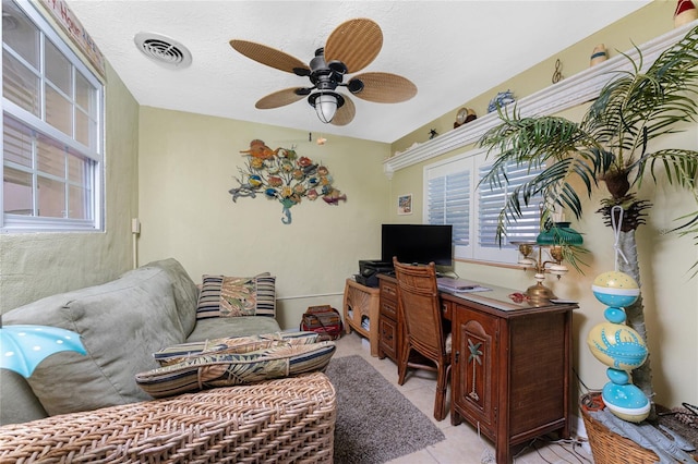 1670 Faust Dr, Englewood, FL 34224 - office area with a wealth of natural light, light tile patterned floors, visible vents, and a ceiling fan