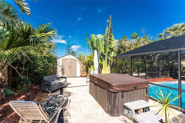 1670 Faust Dr, Englewood, FL 34224 - view of patio / terrace featuring an outdoor structure, an outdoor pool, a shed, a lanai, and a hot tub