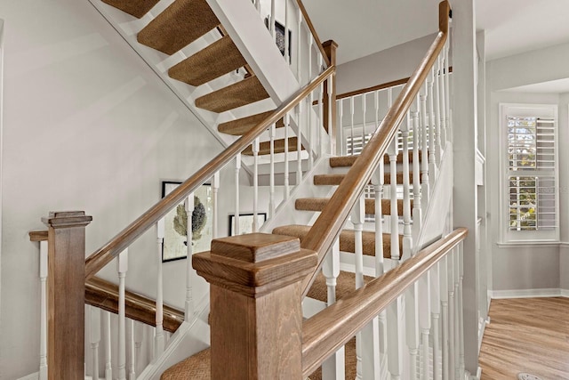 17 Seawatch Dr, Boca Grande, FL 33921 - staircase with wood finished floors and baseboards