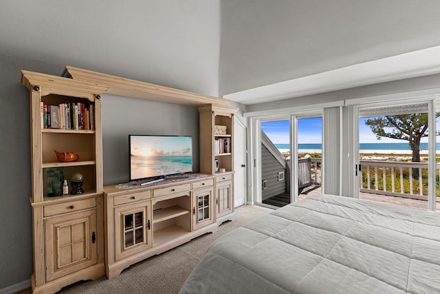 17 Seawatch Dr, Boca Grande, FL 33921 - bedroom with multiple windows, light colored carpet, and access to outside