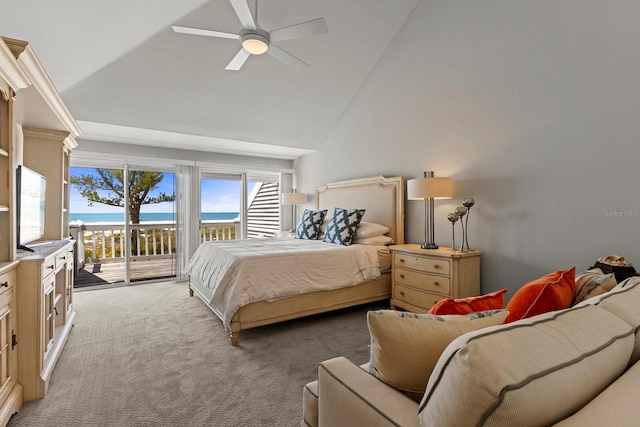 17 Seawatch Dr, Boca Grande, FL 33921 - bedroom featuring lofted ceiling, access to exterior, a water view, light colored carpet, and ceiling fan
