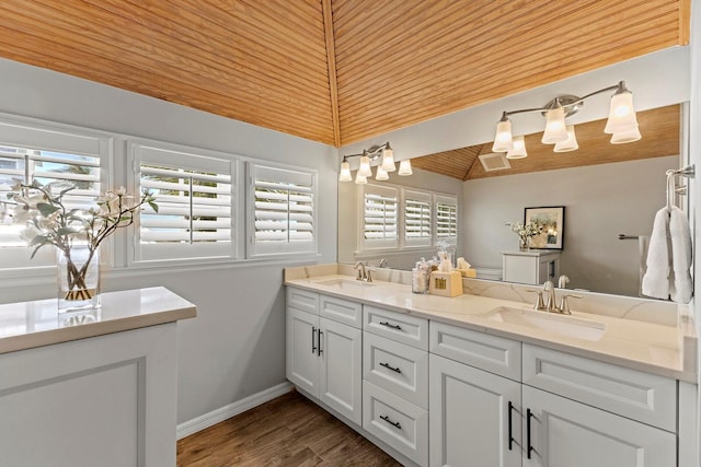 17 Seawatch Dr, Boca Grande, FL 33921 - full bathroom featuring double vanity, vaulted ceiling, wood ceiling, and a sink