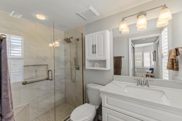 17 Seawatch Dr, Boca Grande, FL 33921 - bathroom featuring a stall shower, visible vents, vanity, and toilet