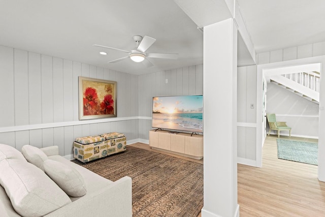 17 Seawatch Dr, Boca Grande, FL 33921 - living area with wood finished floors, a ceiling fan, and stairway