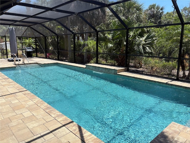 941 Elwood Ave, Englewood, FL 34223 - outdoor pool with a patio area, a lanai, and a grill