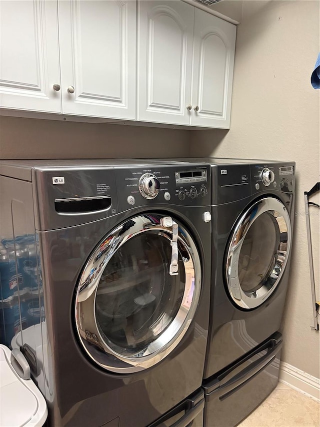941 Elwood Ave, Englewood, FL 34223 - washroom featuring independent washer and dryer and cabinet space