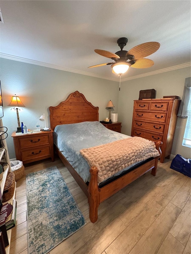941 Elwood Ave, Englewood, FL 34223 - bedroom with light wood finished floors, crown molding, and ceiling fan