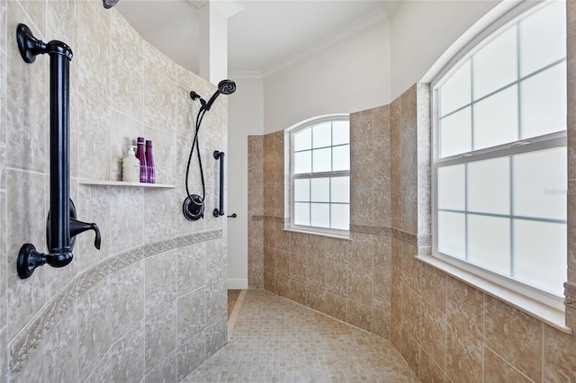 full bath with ornamental molding and tiled shower
