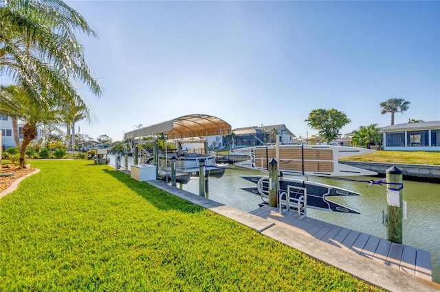 view of dock featuring a lawn, boat lift, and a water view