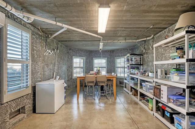 dining space featuring finished concrete floors