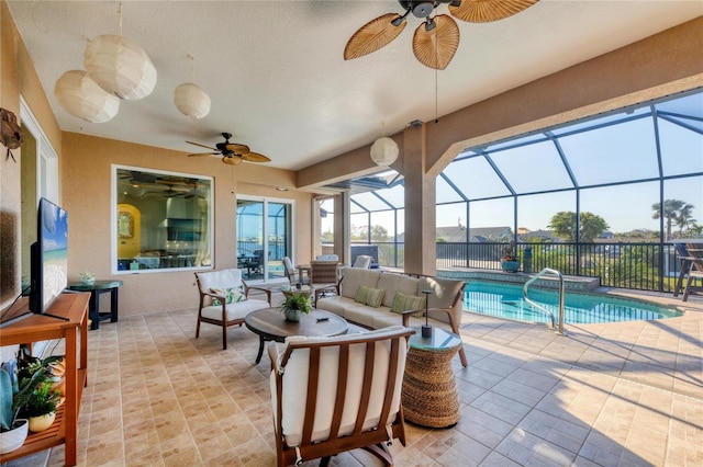 view of patio / terrace featuring a fenced in pool, outdoor lounge area, a lanai, and ceiling fan