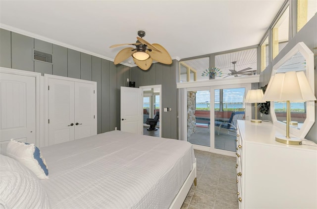 bedroom with crown molding, visible vents, light tile patterned floors, and access to exterior