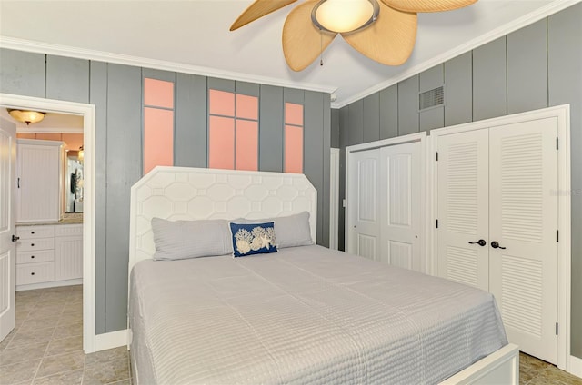 bedroom with two closets, a ceiling fan, crown molding, and visible vents