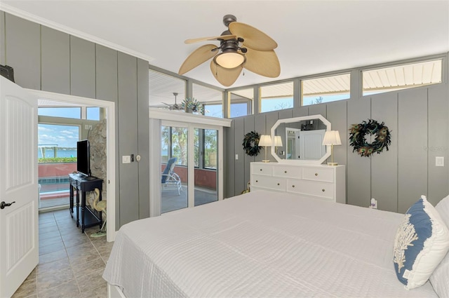 bedroom featuring a ceiling fan and access to outside