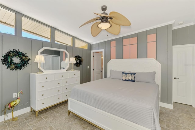 bedroom featuring ceiling fan, baseboards, and ornamental molding