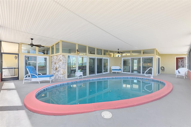 indoor pool with ceiling fan and a patio